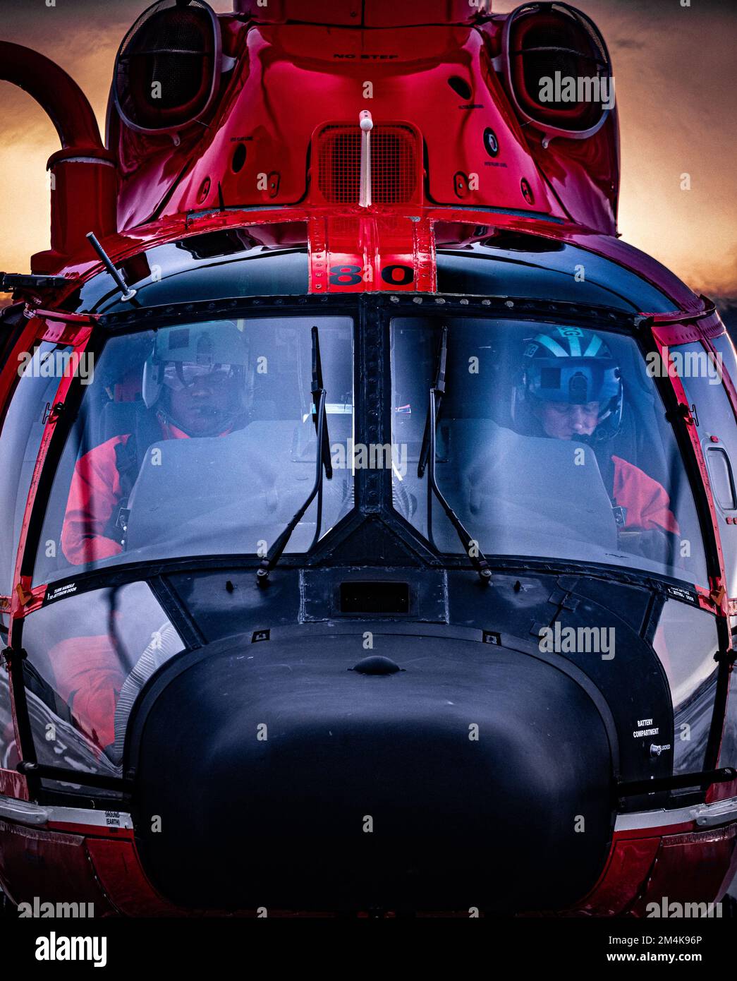 An Air Station Kodiak Alaska Patrol (ALPAT) MH-65 Dolphin helicopter prepares to depart the Forward Operating Location Cold Bay to travel to Dutch Harbor, Alaska, on Jan. 25, 2022. U.S. Coast Guard photo by Lt. Scott Kellerman. Stock Photo