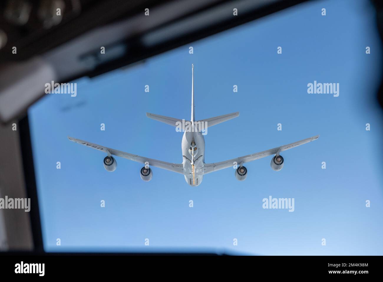 A KC-135 Stratotanker from Fairchild Air Force Base, Washington, flies over a McConnell Air Force Base, Kansas, KC-46A Pegasus in preparation for in-flight refueling, in the Indo-Pacific, Dec. 17, 2022. During in-flight refueling the KC-46A Pegasus was able to onload more than 100,000 pounds of fuel from the KC-135 Stratotanker, supporting long-range strike capabilities. (U.S. Air Force photo by Airman 1st Class Felicia Przydzial) Stock Photo