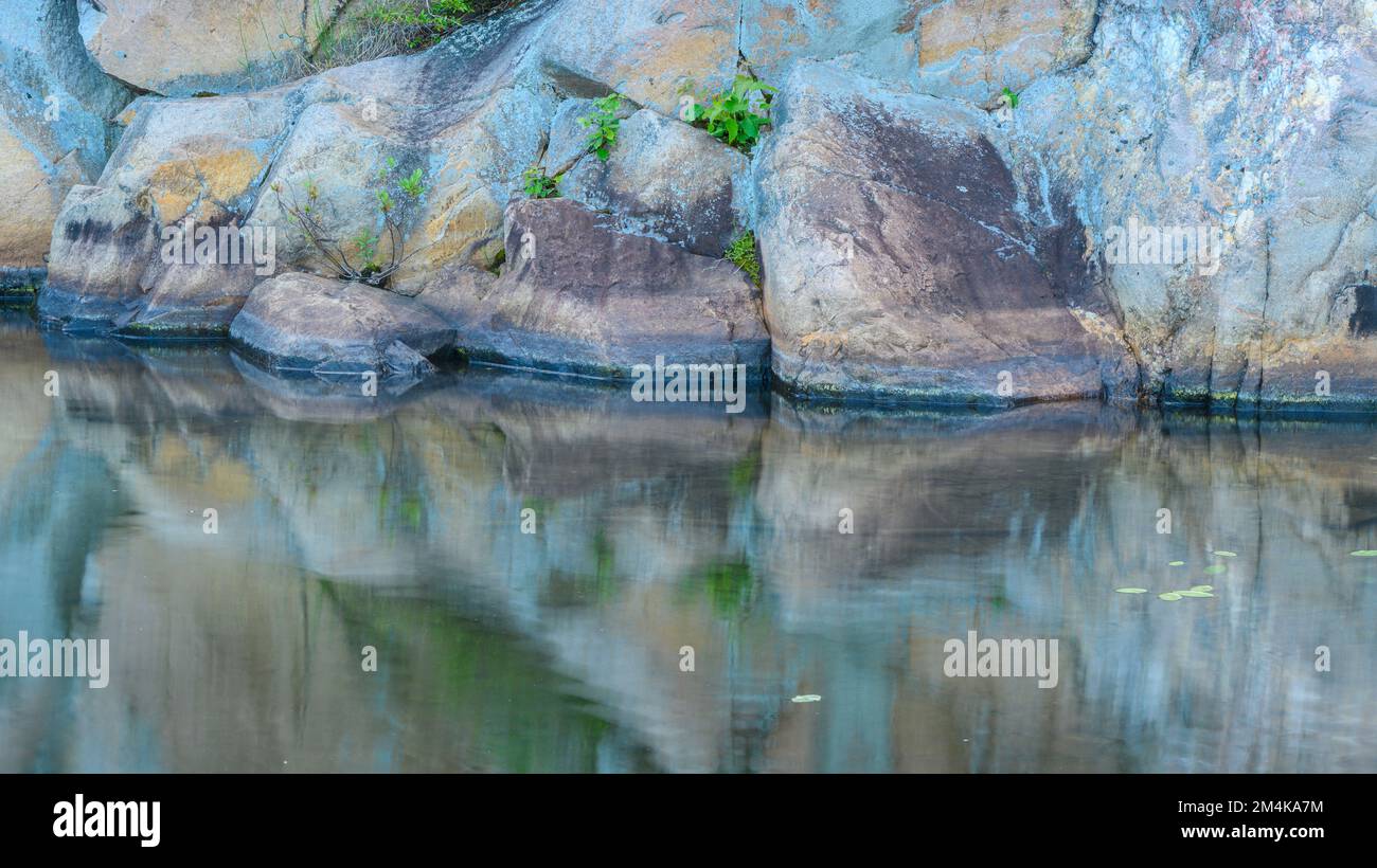 Pink granite reflected in Lake, Killarney Provincial Park