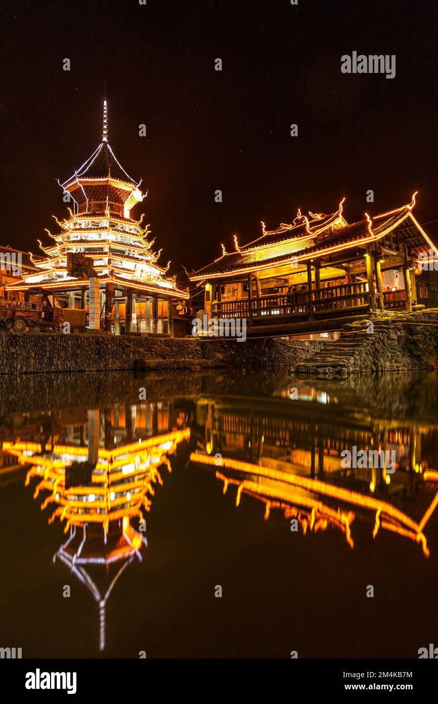 Night view of Drum Tower and corridor bridge in Dong Village Ancient town of Zhaoxing, Qiandongnan, Guizhou Province, China, October 5, 2010. Stock Photo