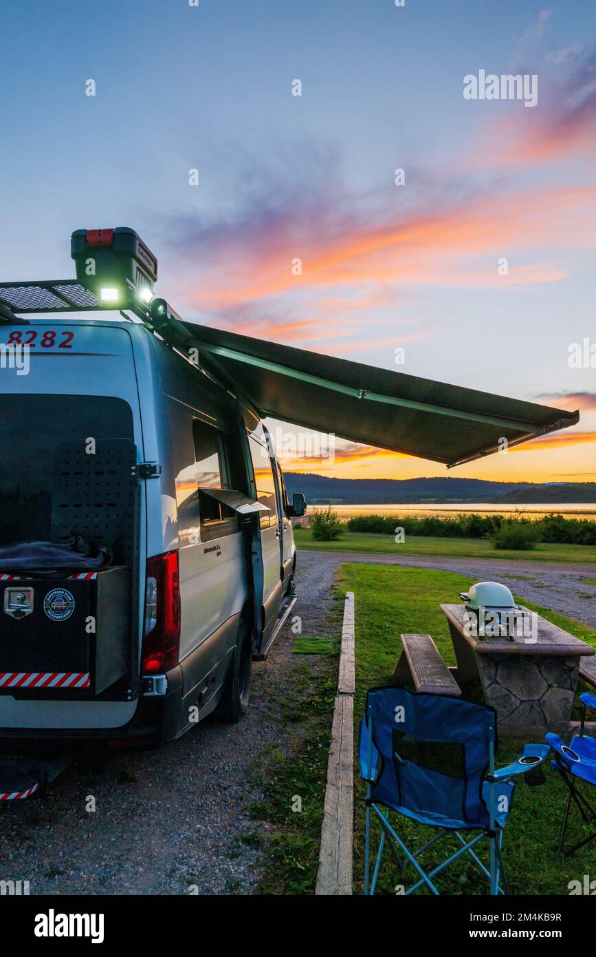 Airstream Interstate 24X 4WD campervan at sunset; White Swan Park Campground; Fraser Lake; British Columbia; Canada Stock Photo