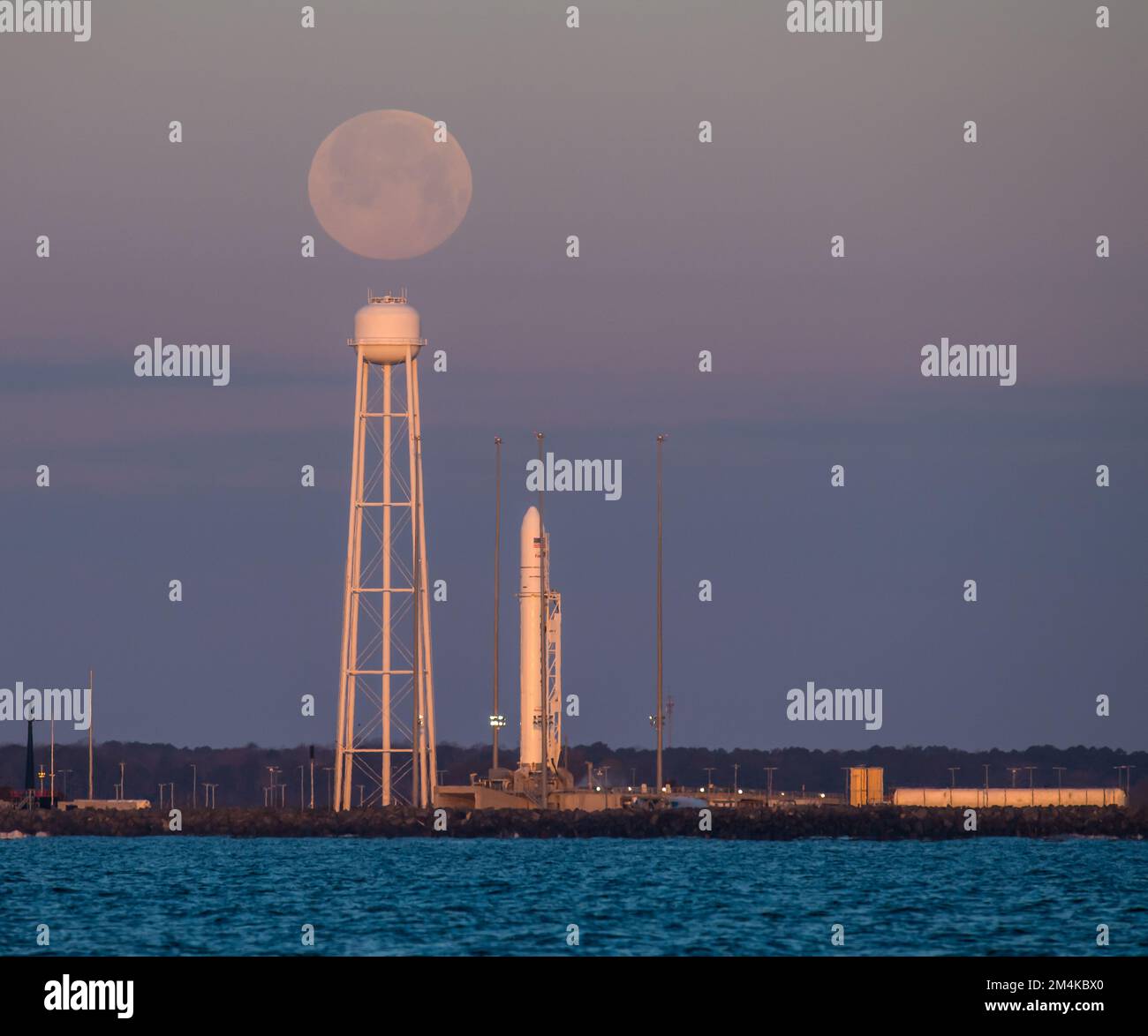 A Northrop Grumman Antares rocket carrying a Cygnus resupply spacecraft during sunrise, soon launching. Digitally enhanced. Elements of image by NASA Stock Photo