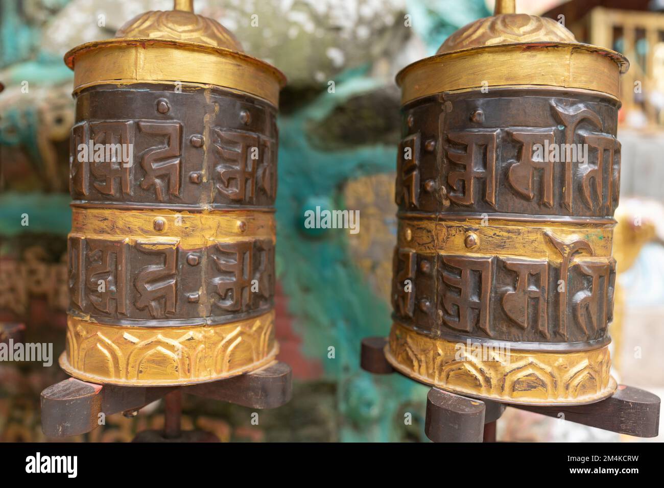 A closeup of copper Buddhist prayer drums Hurde with Indian writings Stock Photo