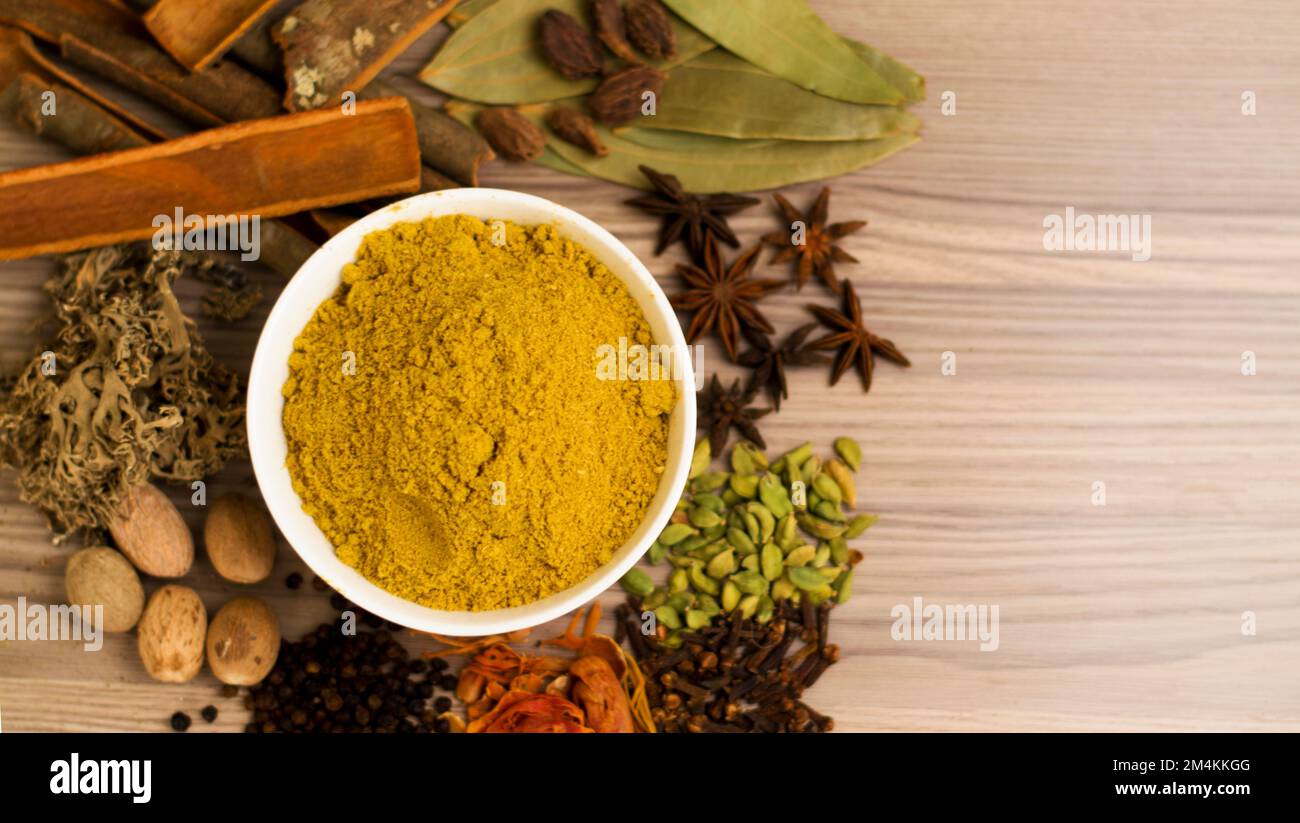 Some Indian spices on a table with Indian bay leaf, javitri, dry