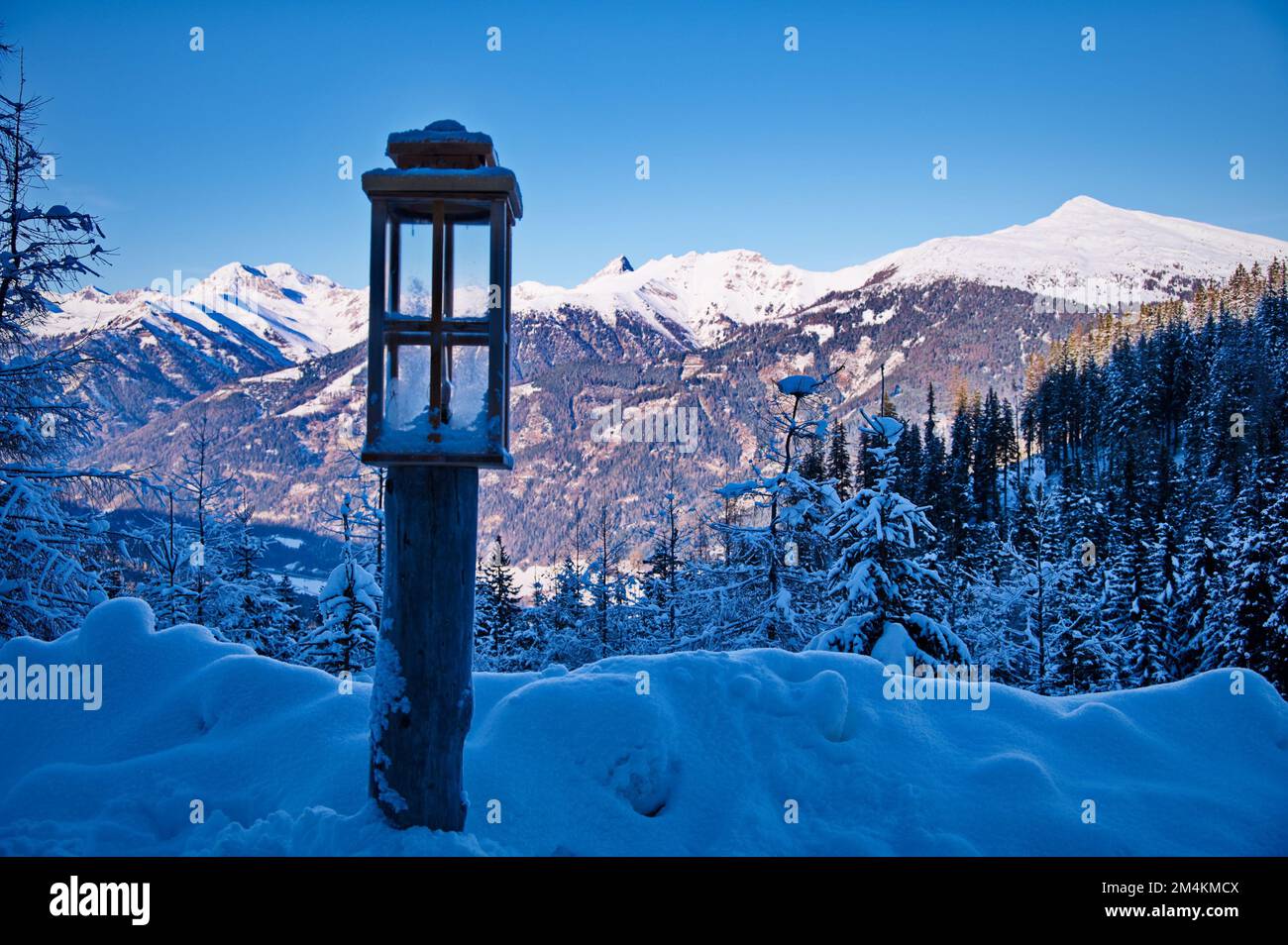 Beautiful winter landscape with lantern in front, Austria Stock Photo