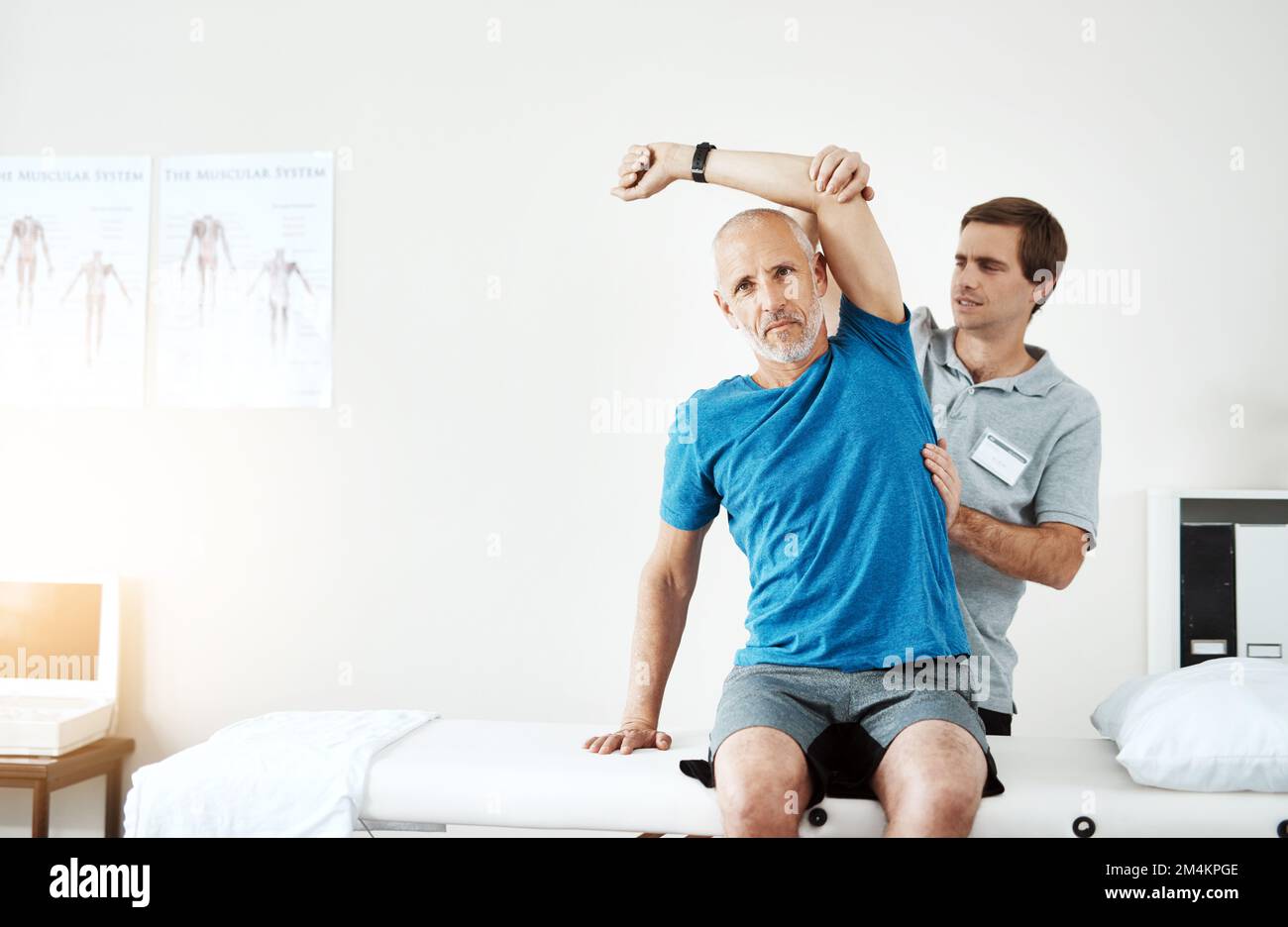 This is the last exercise for the day. a young male physiotherapist