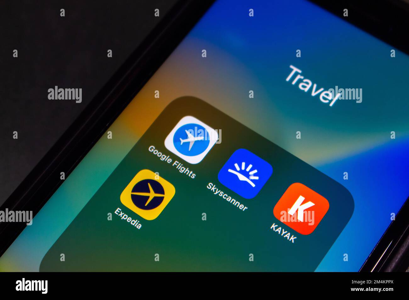 Google Flights, Skyscanner, KAYAK and Expedia icons seen in iPhone screen. An online flight booking search service and travel technology concept Stock Photo