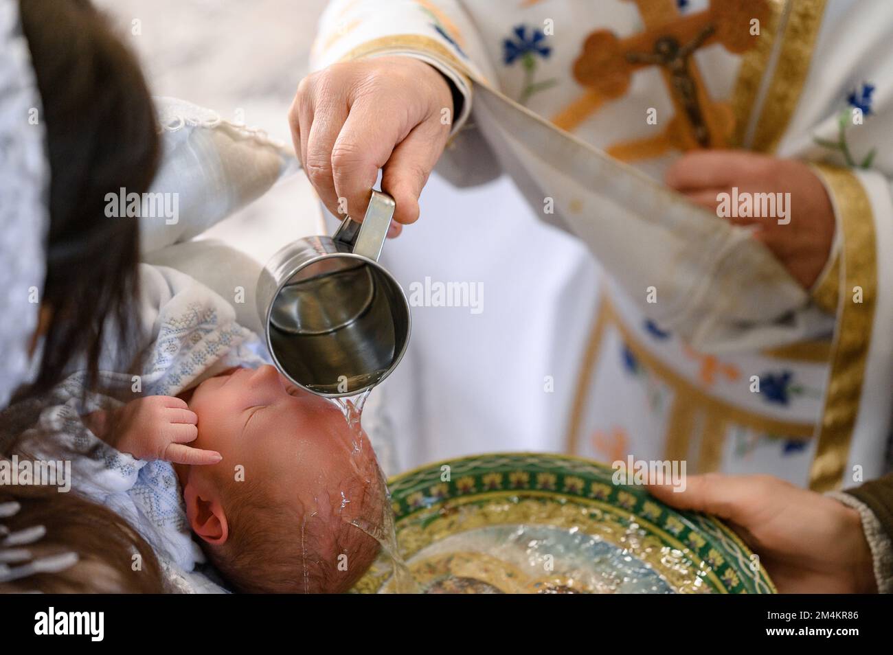 Moments of baptism of the child in the temple of God, Christian