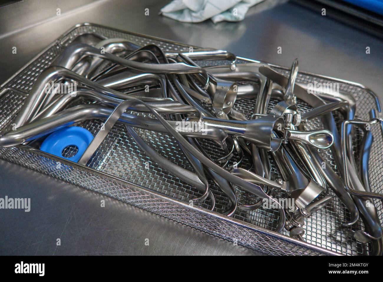 many different gynecological specula are cleaned and disinfected in a