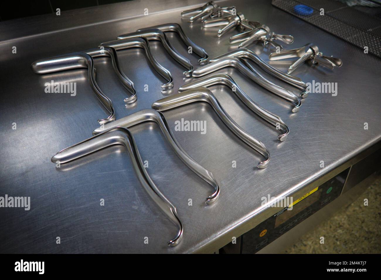 many different gynecological specula are cleaned and disinfected in a