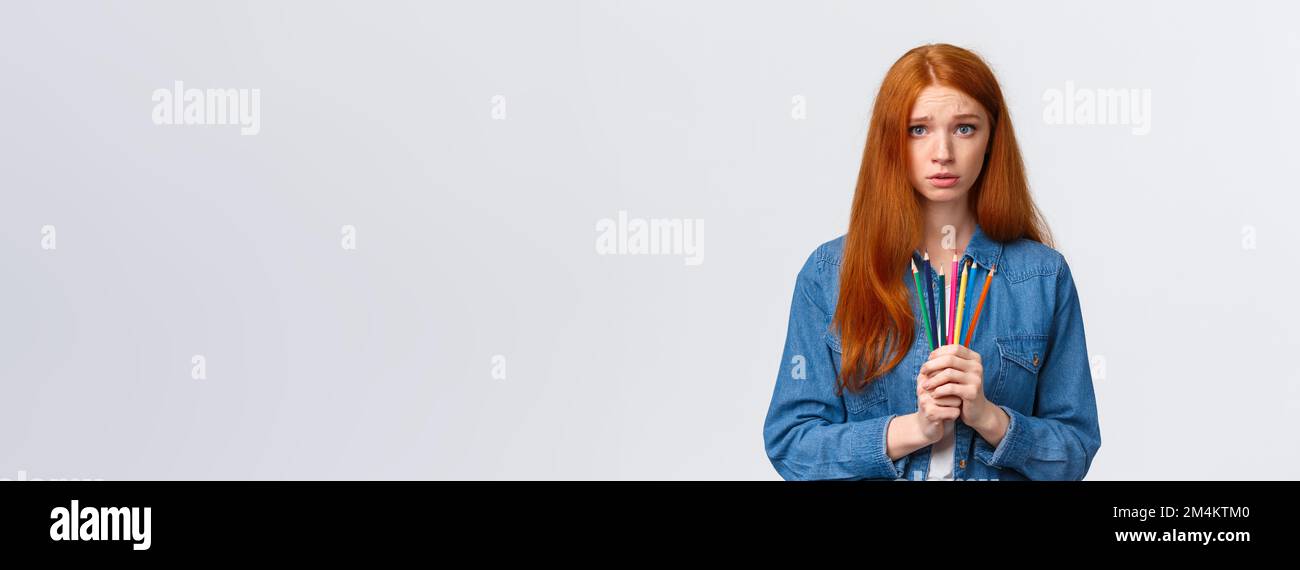 Gloomy and unsure, indecisive timid redhead girl shy showing her ...
