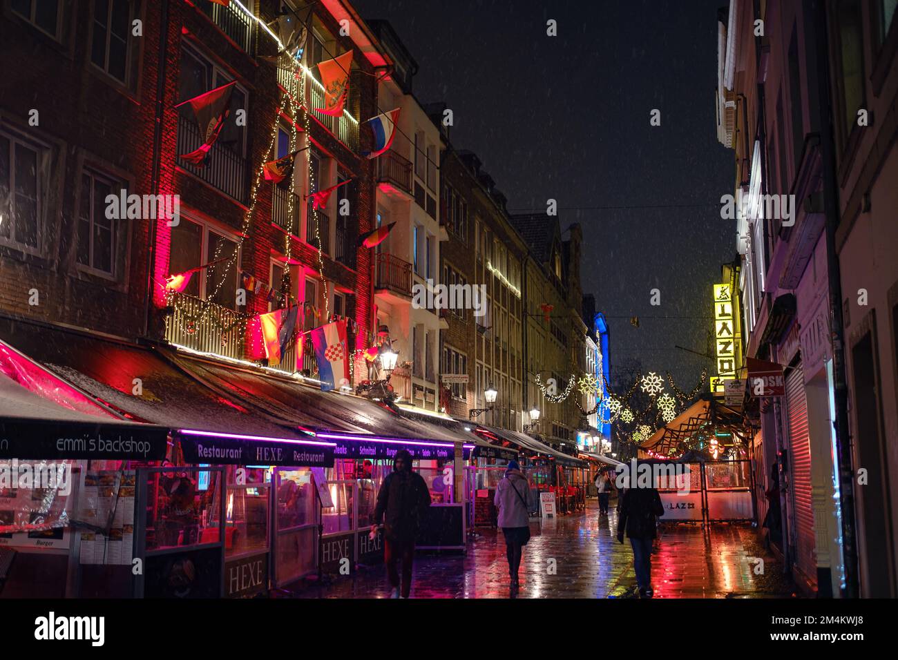 Dusseldorf. GERMANY. 13 DECEMBER 2022. The Christmas in Germany. Christmas market spirit. Celebrating Xmas holidays. Lights, carousel, small houses at Stock Photo