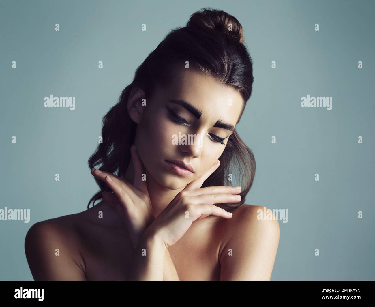 Being normal is overrated. Studio shot of an attractive young woman wearing artistic makeup. Stock Photo