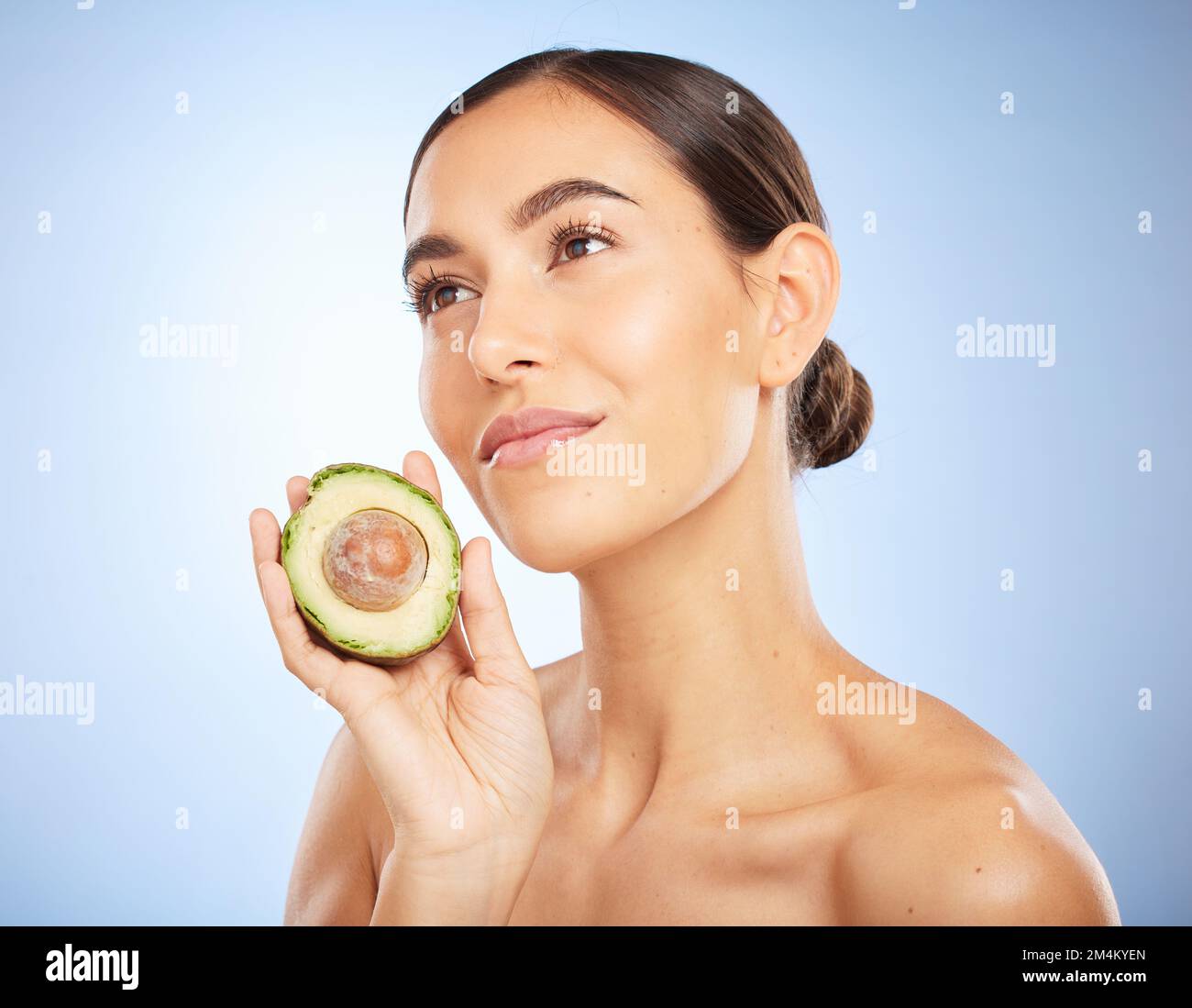 Beauty, health and skincare with woman and avocado for facial, natural products and detox. Nutrition, spa and diet with face of girl model for self Stock Photo