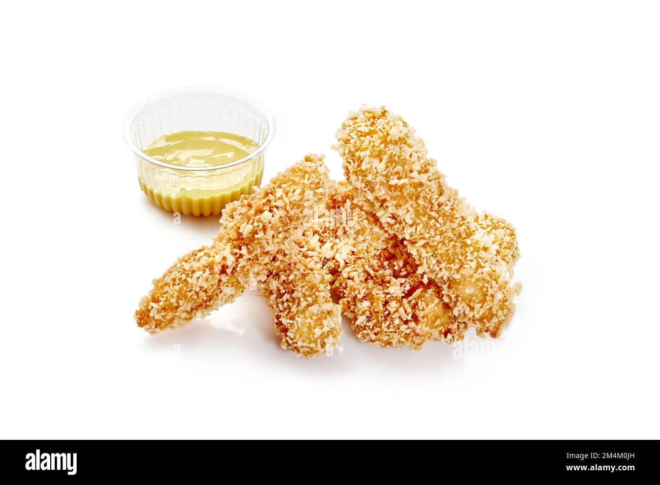 Fried chicken strips in crispy breading with cheese sauce Stock Photo