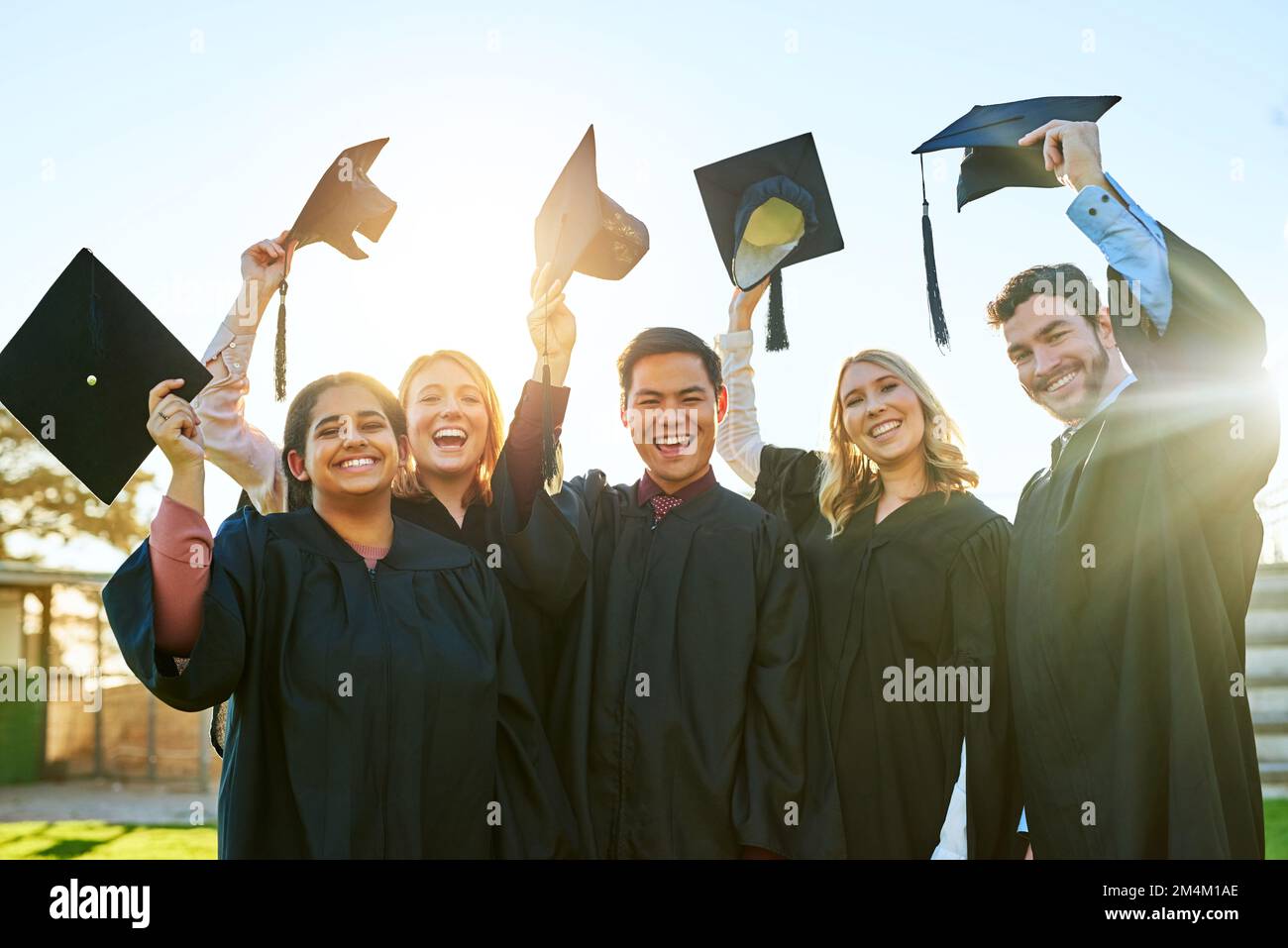 Hats off to our greatest victory. Portrait of a group of students
