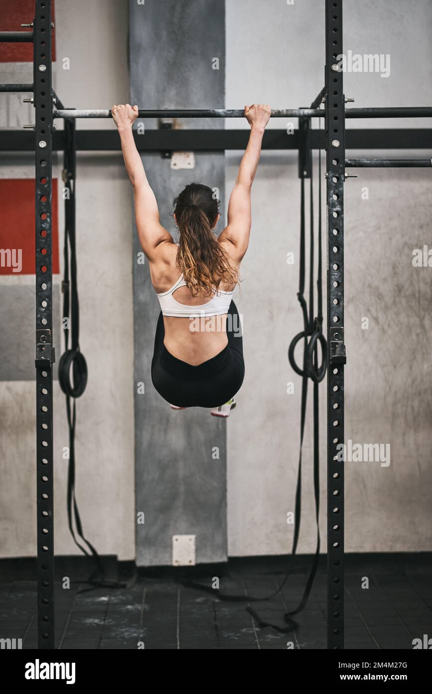 Woman doing pull ups at gym hi-res stock photography and images - Alamy