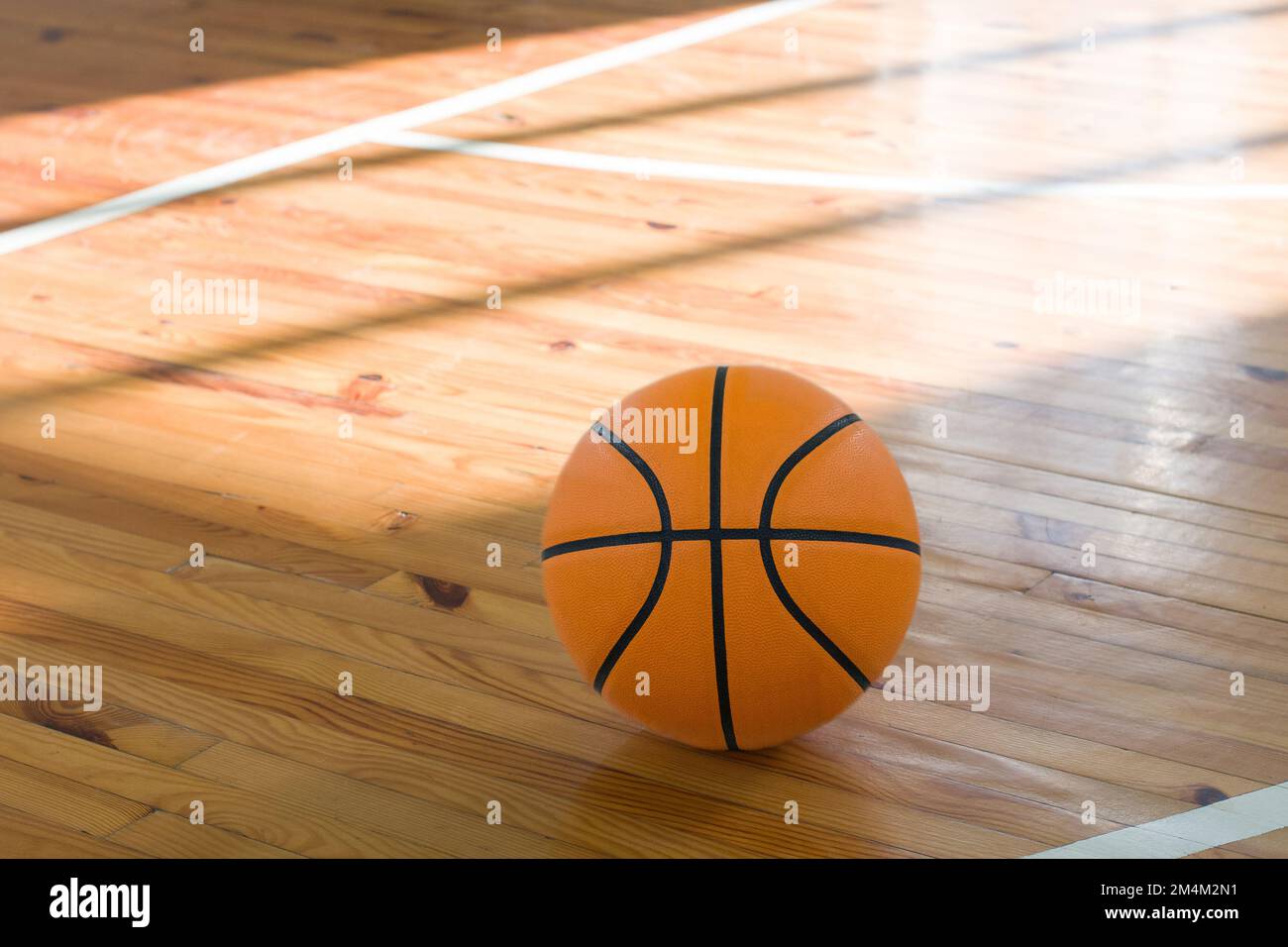 Basketball ball over floor in the gym Stock Photo