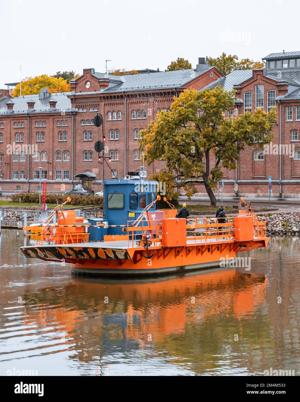 A vertical shot of a Fori ferry in Aura river in autumn in Turku, Finland Stock Photo