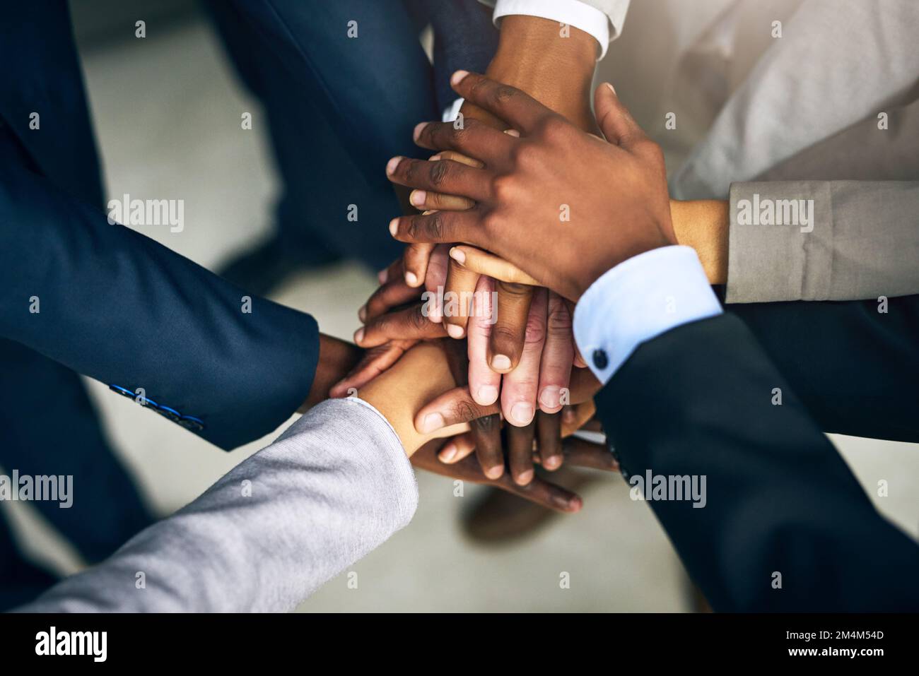 Lets stand together and achieve the impossible. High angle shot of a ...
