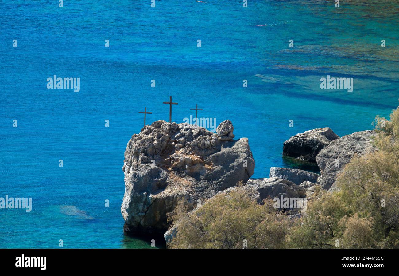 Panorama view of the three crosses on rocks beside sea south of Stegna, Archangelos, Rhodes, Dodecanese Islands, Greece Stock Photo