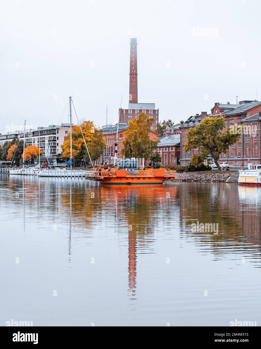 A vertical shot of a Fori ferry in Aura river in autumn in Turku, Finland Stock Photo