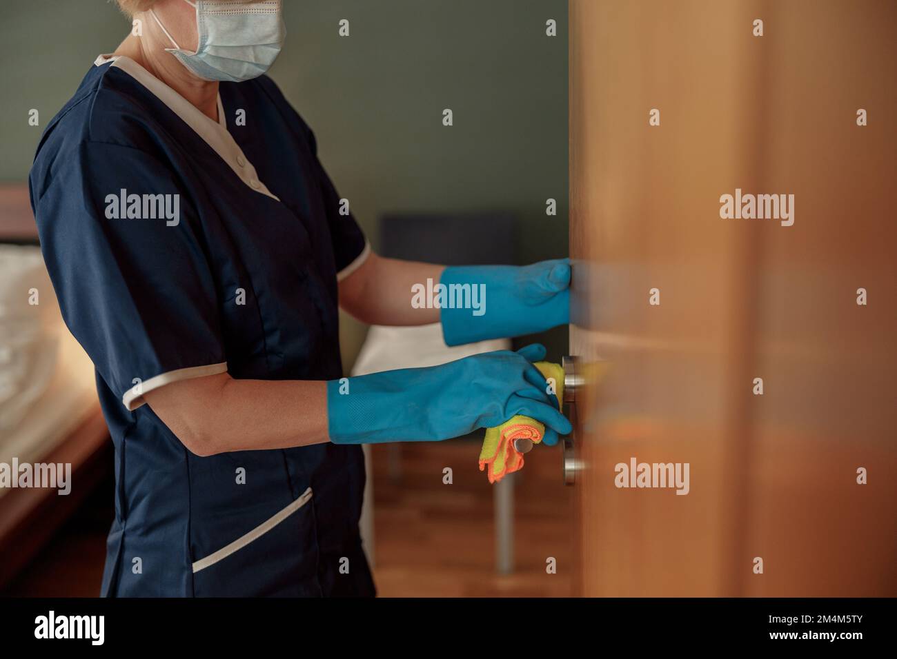 Young women in rubber gloves hi-res stock photography and images - Alamy
