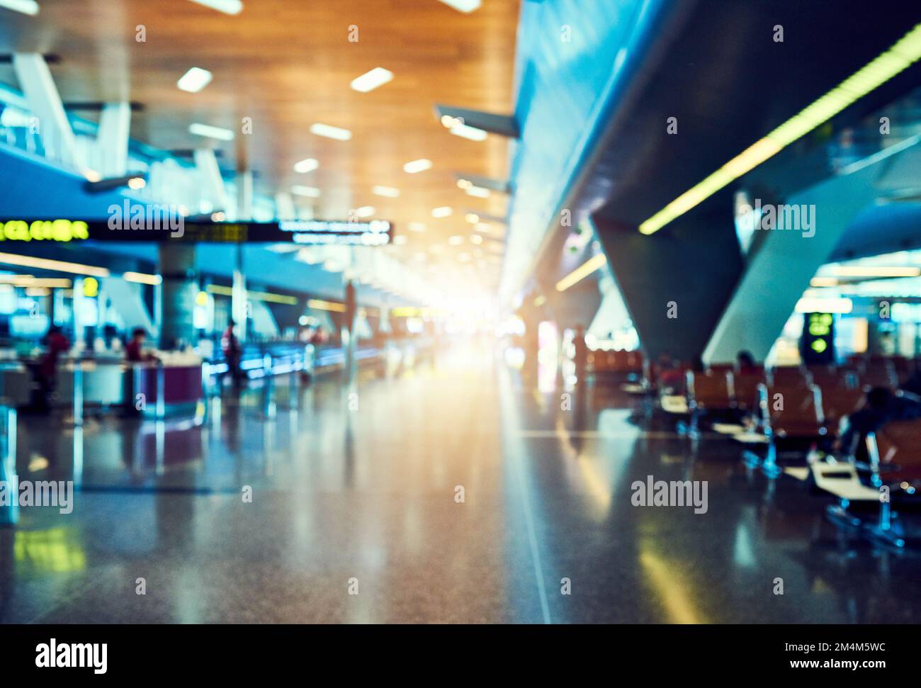 The path to seeing the world. rows of seats in an empty airport departure lounge. Stock Photo
