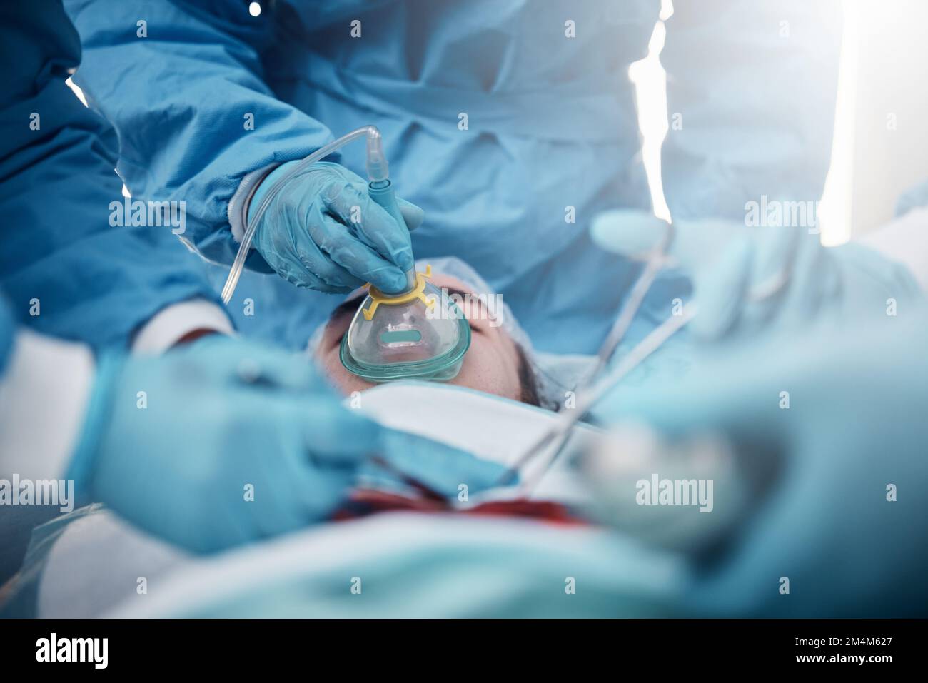 Doctors, surgery and oxygen mask with a medicine team in scrubs ...
