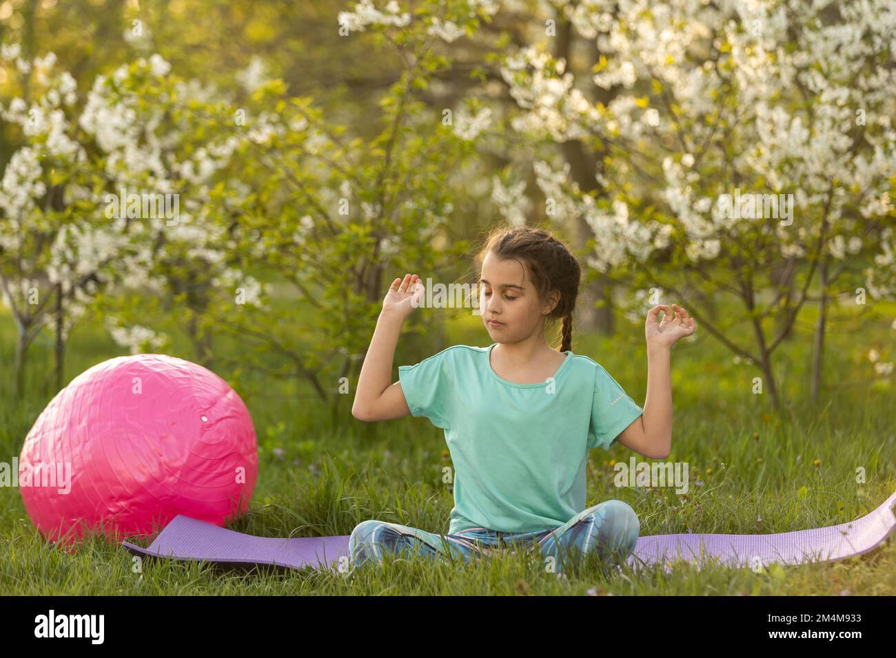 child doing gymnastics exercises. Sports, learning, fitness, stretching ...