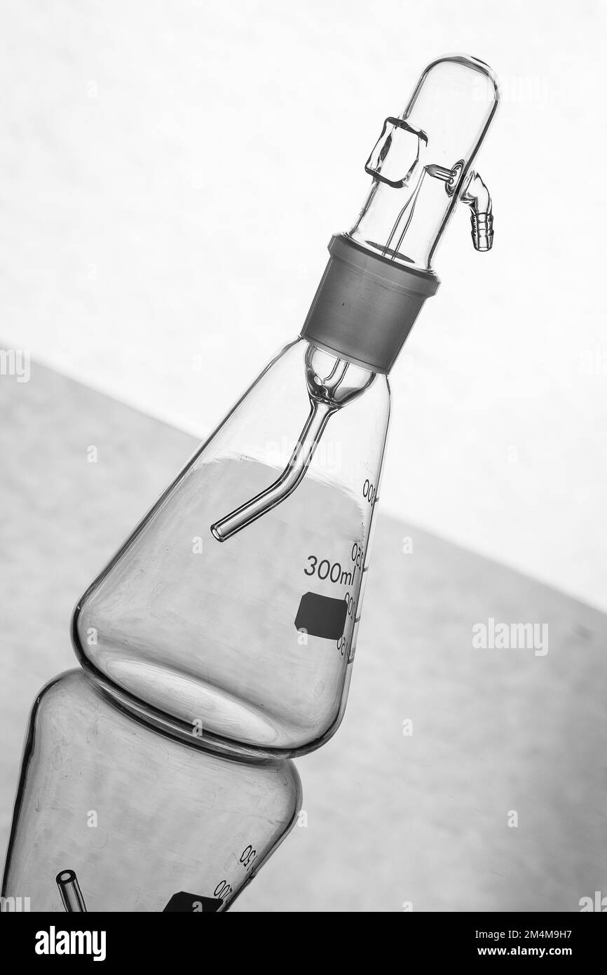 Silhouette of a glass flask with empty nebulizer, backlit on a