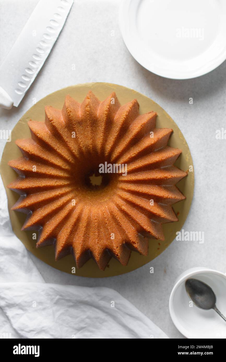 https://c8.alamy.com/comp/2M4MBJB/flat-lay-of-homemade-bundt-cake-spiral-bundt-cake-top-view-of-coconut-bundt-cake-2M4MBJB.jpg