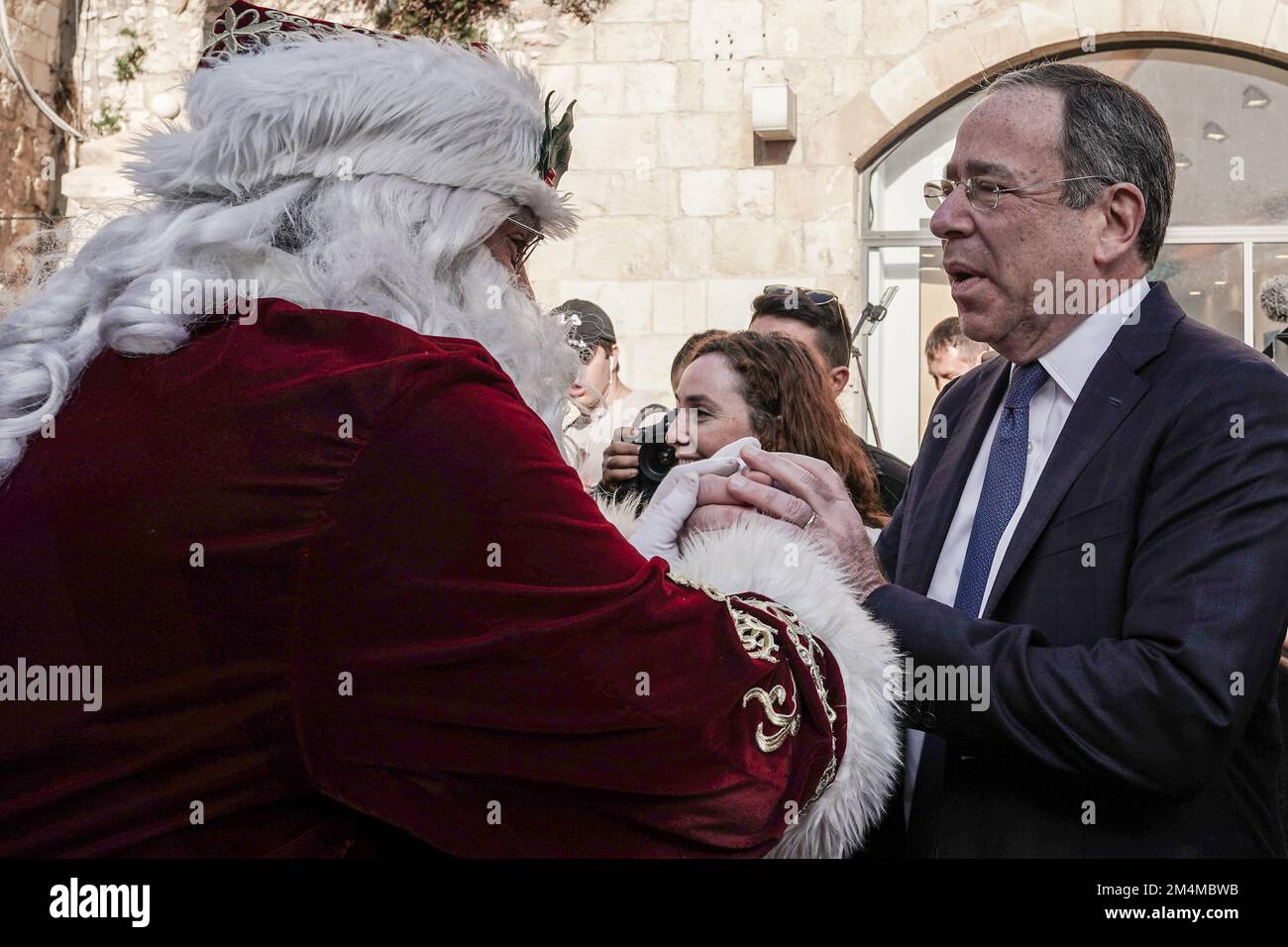 Jerusalem, Israel. 22nd Dec, 2022. U.S. Ambassador to Israel, THOMAS NIDES, greets Santa Claus, portrayed by ISSA KASSISSIEH, at the Old City's Jaffa Gate. Credit: Nir Alon/Alamy Live News Stock Photo