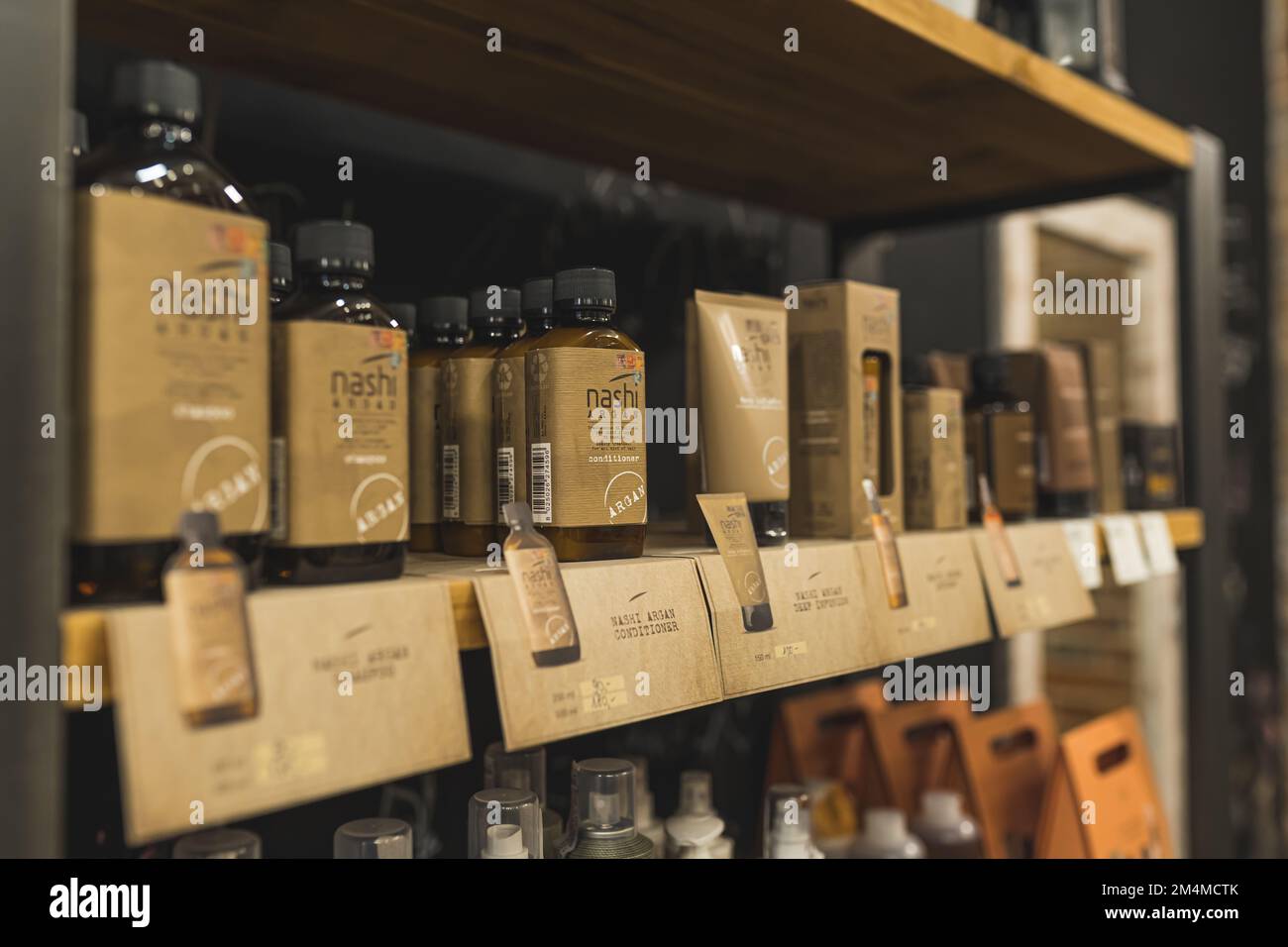 12.02.2022 Warsaw, Poland. Professional cosmetics for haircare and beard care standing on a shelf for clients to buy. High quality photo Stock Photo