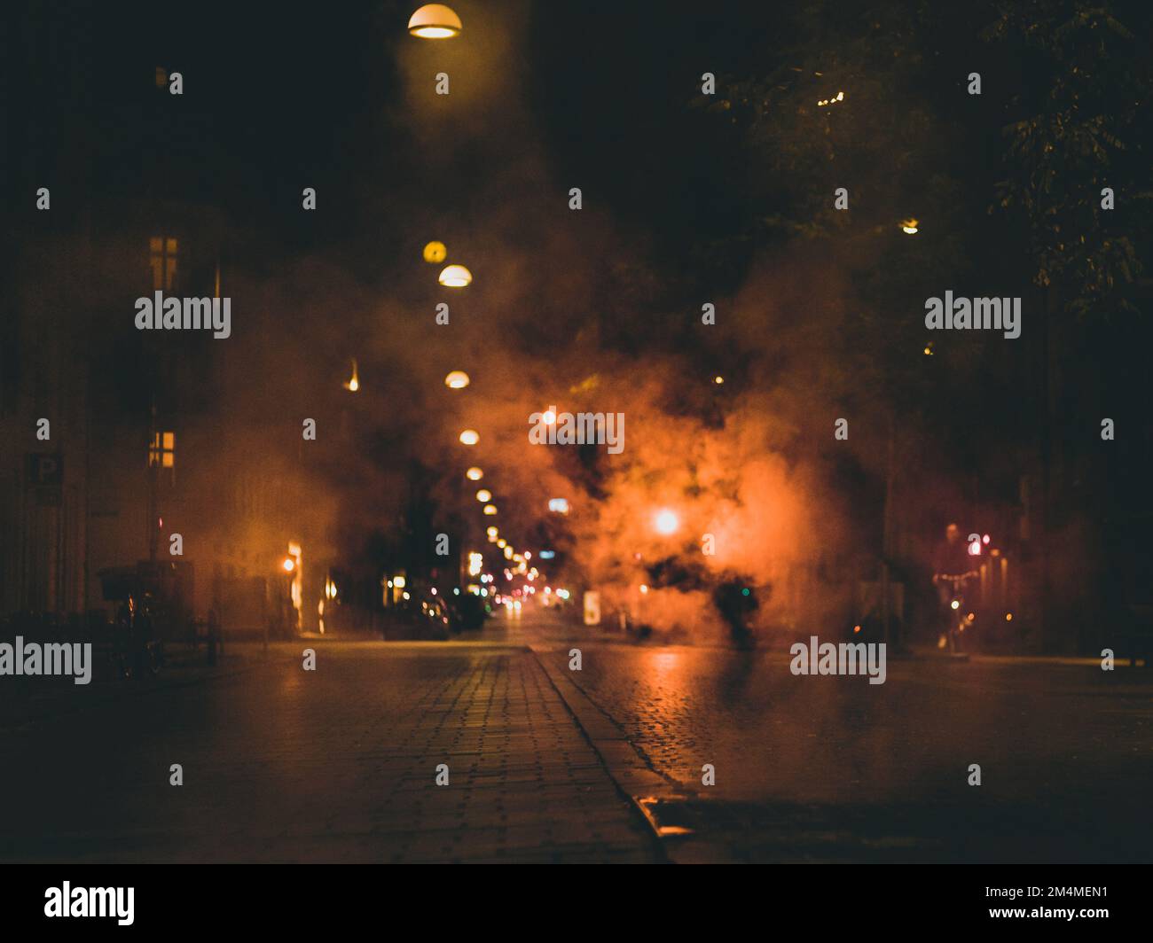 steam over night city street Stock Photo