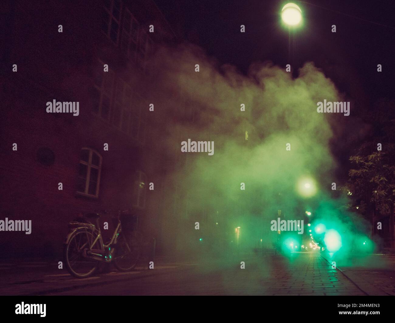 steam over night city street Stock Photo