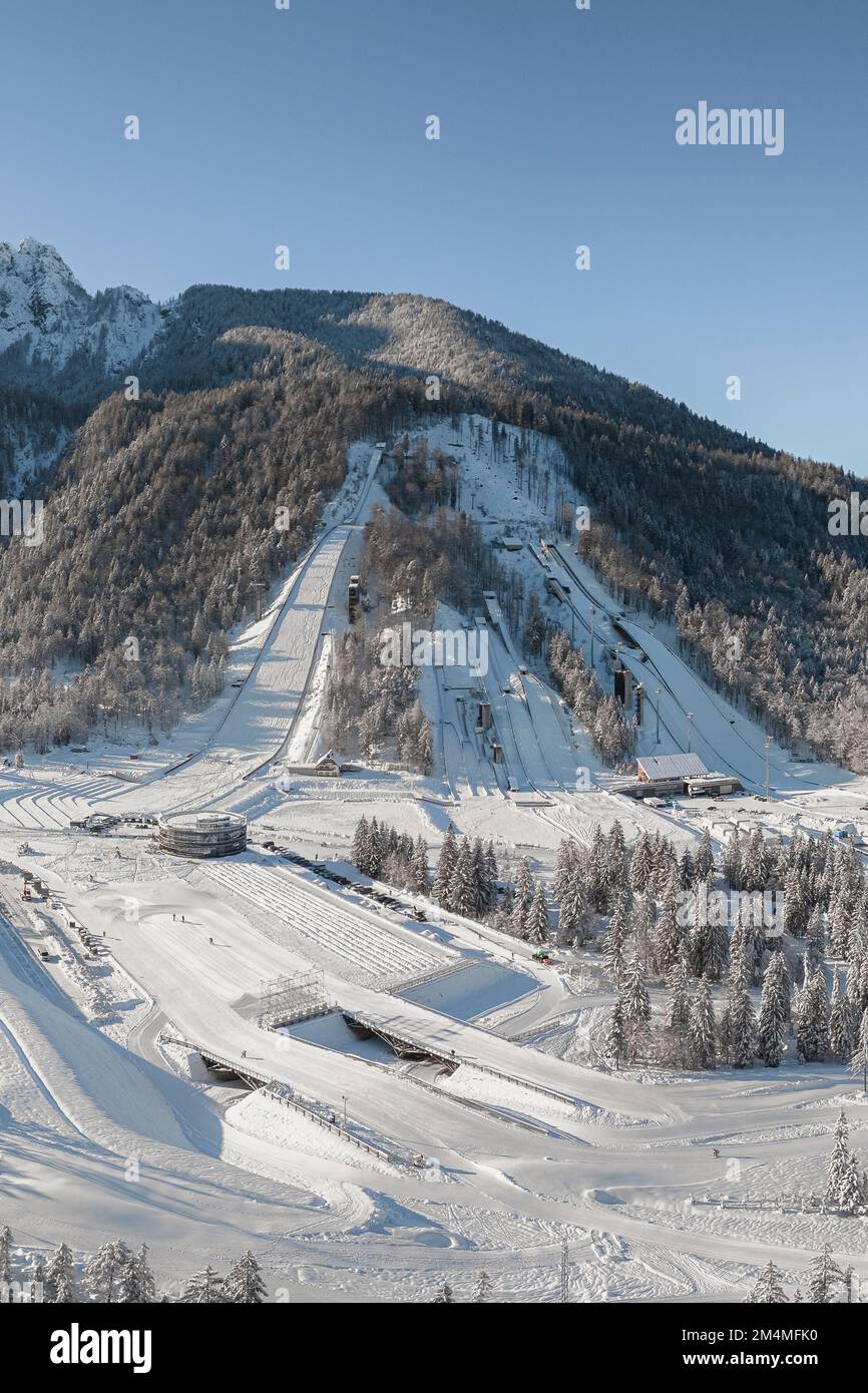 Ski Jump in Planica near Kranjska Gora Slovenia covered in snow at winter time. Aerial Panorama Stock Photo