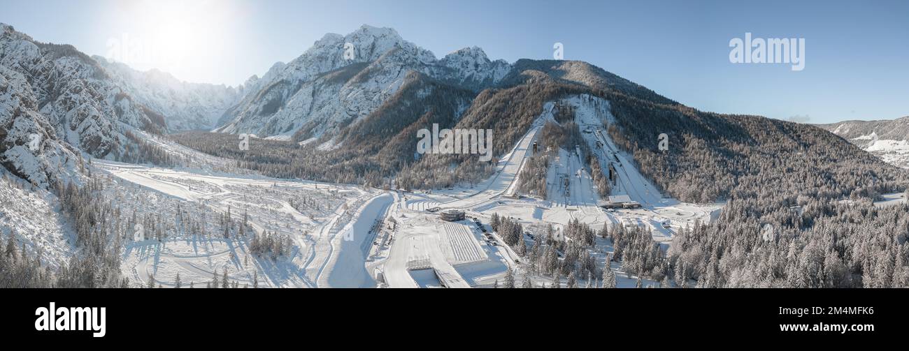 Ski Jump in Planica near Kranjska Gora Slovenia covered in snow at winter time. Aerial Panorama Stock Photo