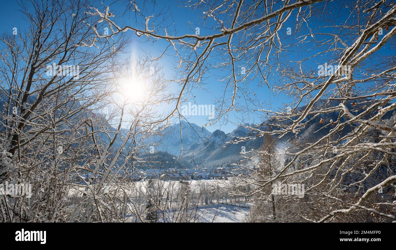 Kranjska Gora in Slovenia covered in snow at winter with Julian Alps and Triglav National Park in the background Stock Photo