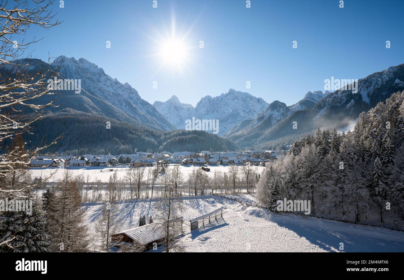 Kranjska Gora in Slovenia covered in snow at winter with Julian Alps and Triglav National Park in the background Stock Photo