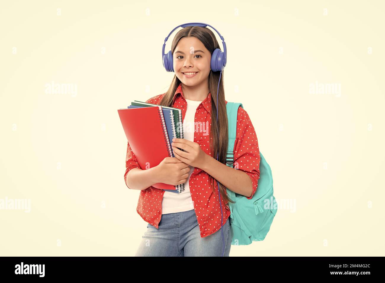 Back to school. Schoolgirl student in headphones with school bag ...