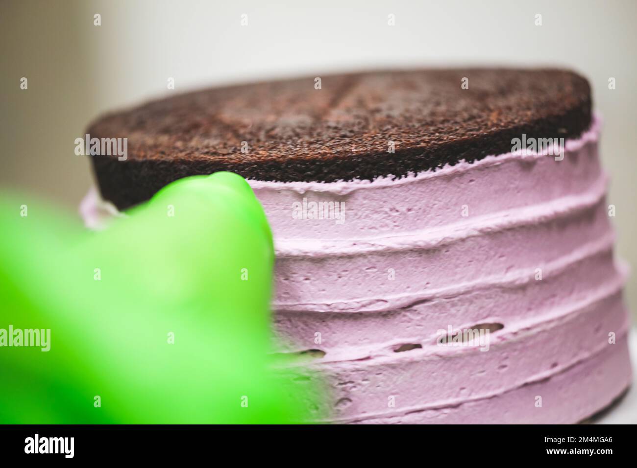 cake chef designer using rose cream filling piping bag decorating