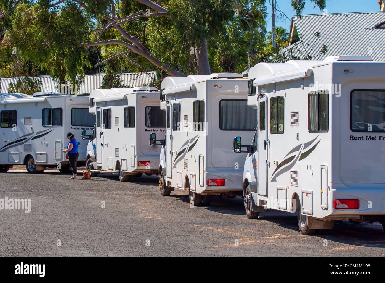 A line of motorhomes parked together near the Darling River in Bourke
