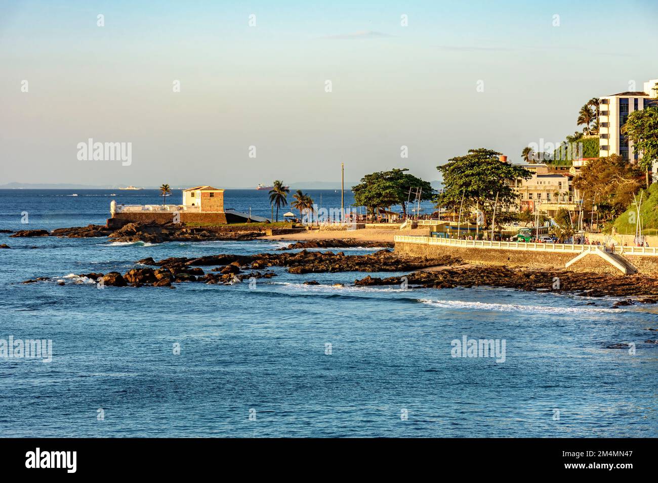 Seafront of the city of Salvador in Bahia with its buildings and the old fort of Santa Maria during the afternoon Stock Photo