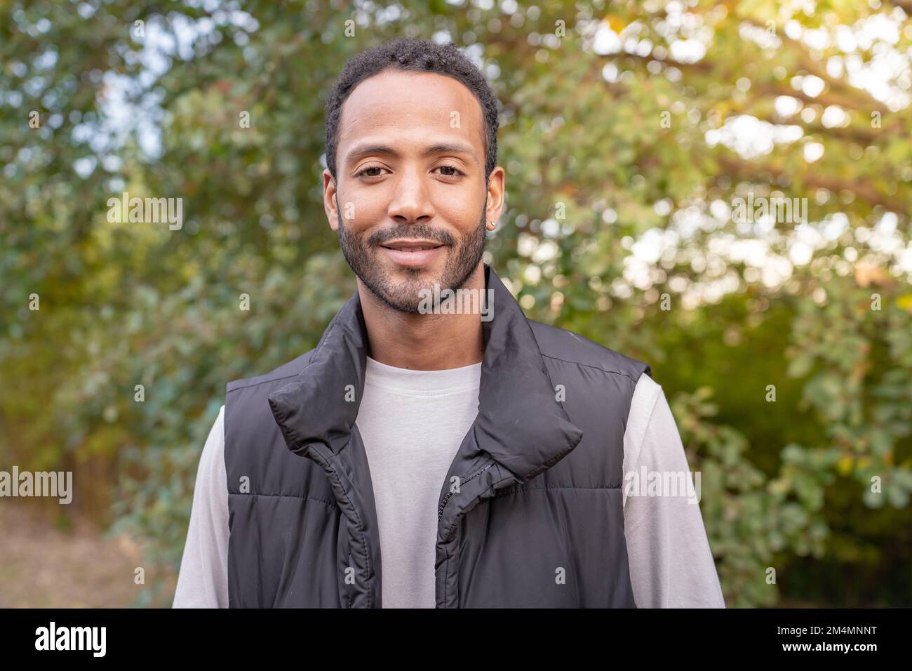 Portrait of an African American man smiling looking confident and joyful at camera. Stock Photo