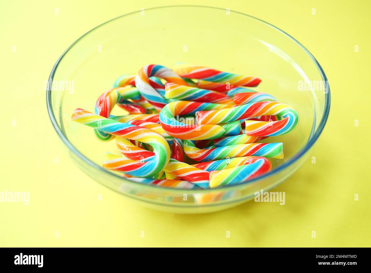mini cherry candy canes on white background  Stock Photo