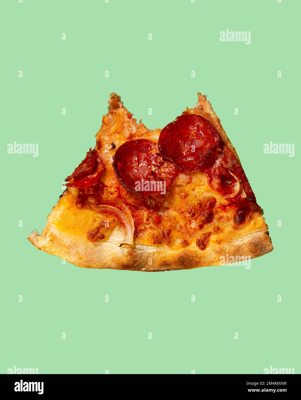 Slice of bitten pepperoni pizza with salami on the background Stock