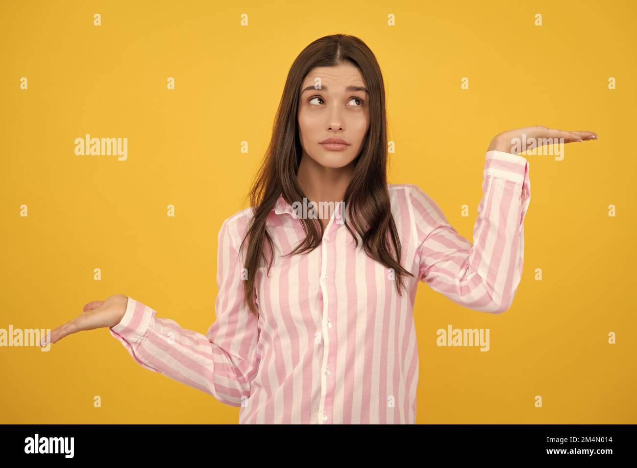 Woman point at copy space, showing copyspace pointing. Promo, girl