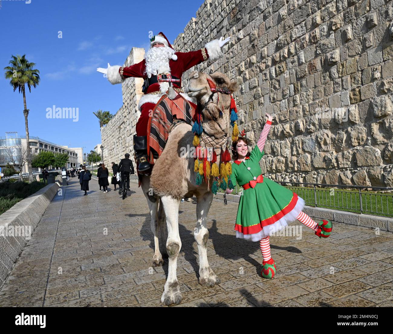 Jerusalem, Israel. 22nd Dec, 2022. Issa Kassissieh, dressed as Santa Claus, rides a camel outside the Old City of Jerusalem, on Thursday, December 22, 2022, days before Christmas. Photo by Debbie Hill/ Credit: UPI/Alamy Live News Stock Photo