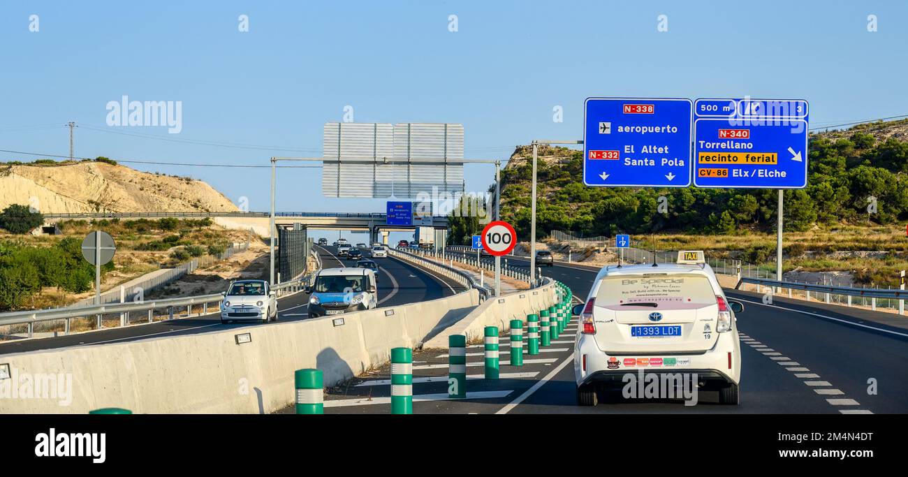 A car drive in a Spanish road by the Alicante city airport. A traffic sign has the information text. Stock Photo
